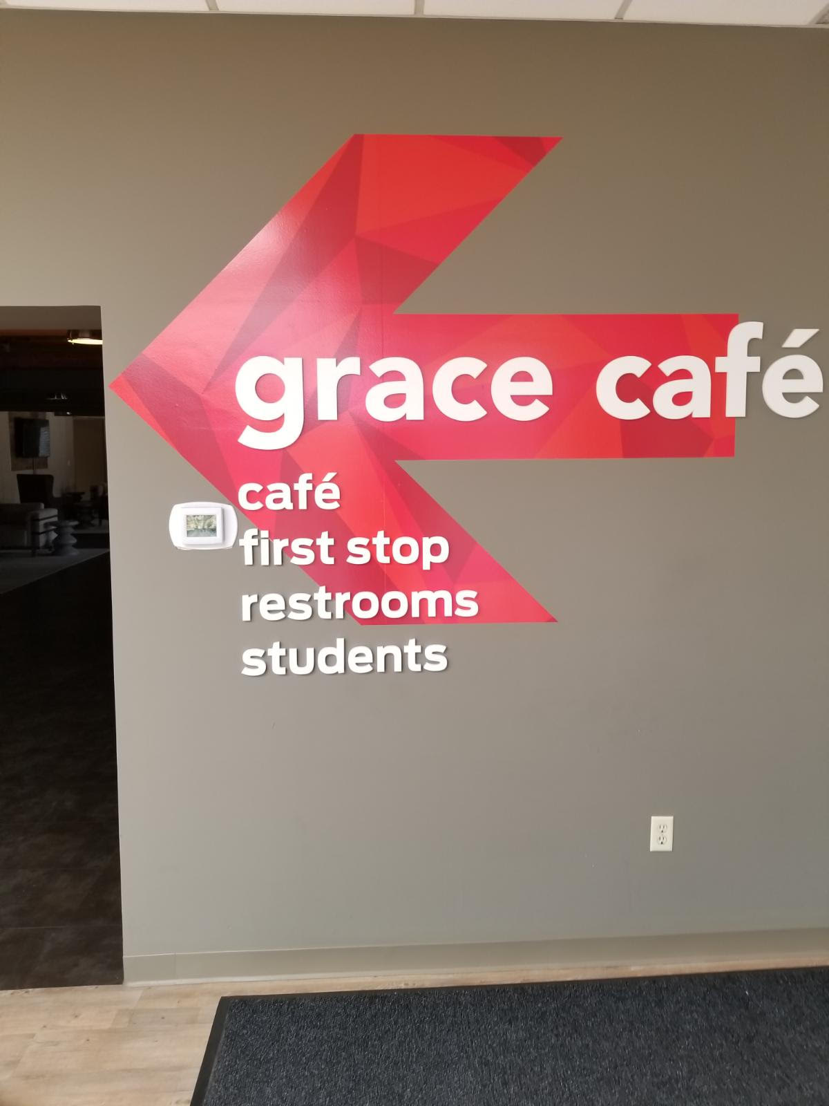 directional sign with red arrow